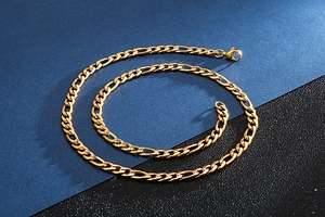 Detailed close-up of 18K gold-plated stainless steel NK Figaro chain with metallic luster