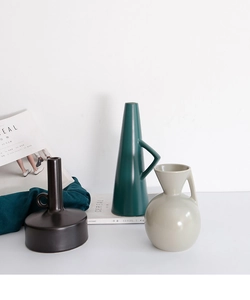 Detailed view of matte ceramic vases in Nordic Morandi style for modern home decor