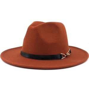 Detail of rust orange fedora hat featuring black faux leather band and gold metal buckle