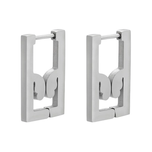 Macro view of geometric silver stainless steel rectangular earrings with abstract patterns
