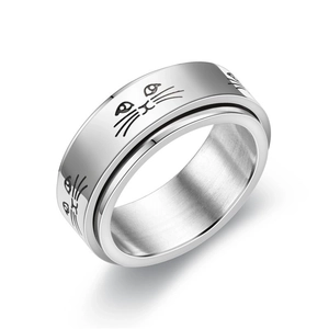 Detailed shot of rotatable silver cat face anxiety ring with polished steel finish