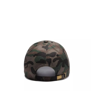 Detail of camouflage baseball cap showing the adjustable gold metal buckle and fabric texture