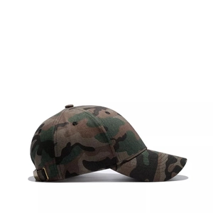 Detail of jungle camouflage baseball cap featuring breathable eyelets and curved brim