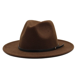 Detail of dark brown fedora hat with flat wide brim and leather strap with gold stud