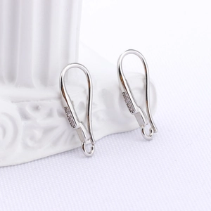 Macro shot of silver earring hooks with cubic zirconia inlay for DIY jewelry design