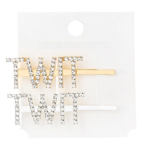 Close-up of TWT letter hair clips with rhinestones in gold and silver plating