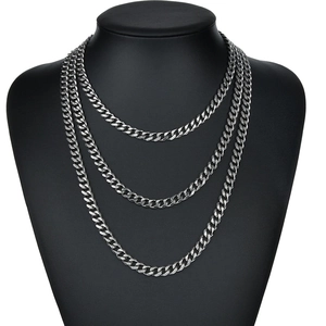 Polished silver stainless steel multi-layer Cuban link necklace on black bust display