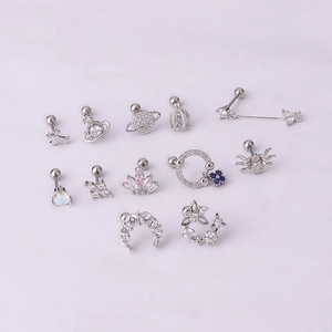 Selection of silver titanium steel cartilage studs with zircon stars and planets