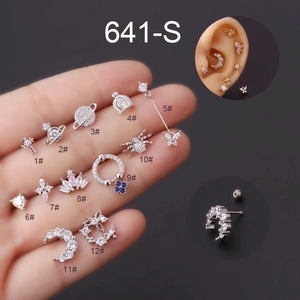 Detailed collection of 12 small titanium steel ear studs featuring celestial and gothic icons