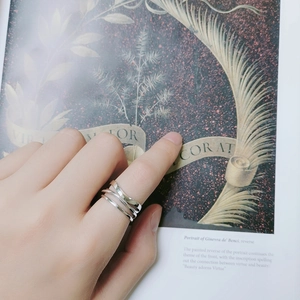 Irregular multi-layer S925 sterling silver crossover ring for women on model's finger