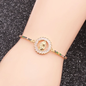 Golden Virgin Mary bracelet with micro-pave multicolored cubic zirconia on black background