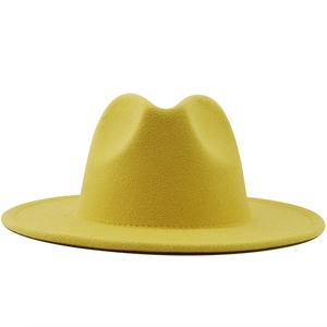 Detail view of the smooth wool felt texture on this modern yellow fedora jazz hat