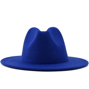 Detail of royal blue wool fedora hat crown and brim stitching on white background