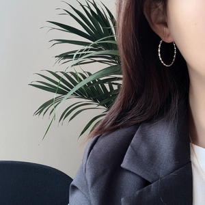 Polished 925 sterling silver twisted hoop earrings with elegant spiral texture