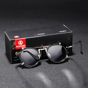 Vintage round metal sunglasses with black lenses and gold frames including packaging box