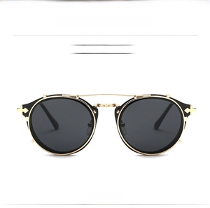Front view of steampunk round metal sunglasses with grey lenses and ornate nose bridge detail