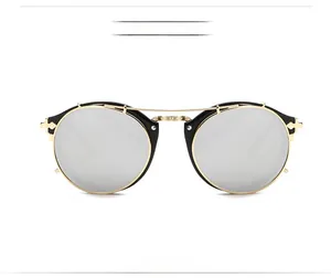 Front view of round steampunk sunglasses with gold metal frame and silver mirror lenses