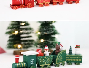 Close-up of four-section wooden Christmas train decor in red and green with gold details