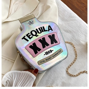 Close-up of laser silver tequila bottle bag with embroidered letters and chain strap