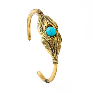 Vintage gold feather open cuff bracelet with central turquoise stone in bohemian style