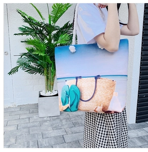 Detail of beach tote bag with thick cotton rope straps and vibrant summer print