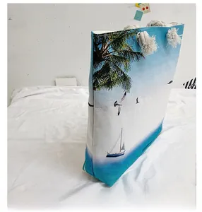Detail of tropical beach print on canvas tote with white cotton rope handles