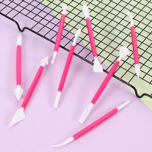 8-piece pink clay carving tool set for DIY pottery and fondant sculpting on colored background