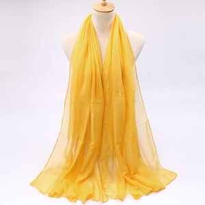 Close-up of lightweight bright yellow voile scarf showing soft texture and sheer fabric