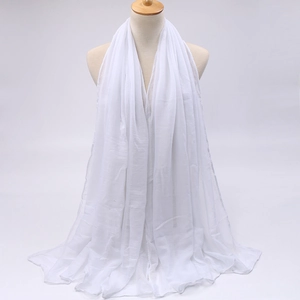 Lightweight white semi-transparent chiffon scarf draped on a wooden mannequin