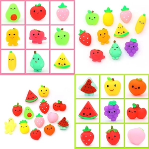 Detailed view of colorful TPR squeeze fruit toys including cute strawberry and apple shapes