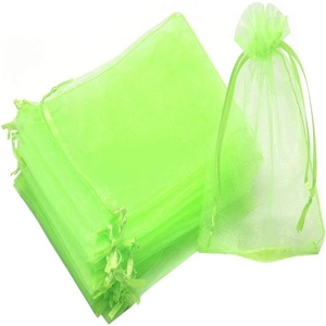 Detail of neon green organza gift bags featuring a drawstring and mesh texture