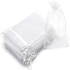 Detailed view of white organza drawstring gift bags with premium sheer mesh texture