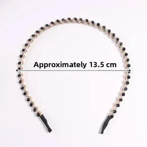Detailed view of crystal headband with black beads and 13.5cm diameter measurement