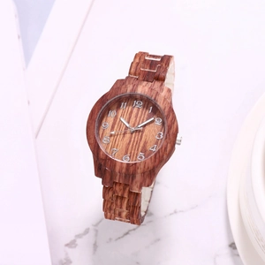 Detailed close-up of brown bamboo texture watch dial with white Arabic numerals on marble