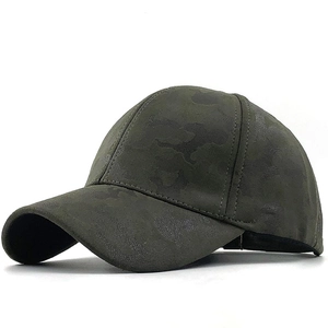 Detail view of dark green camo baseball cap made from premium suede-like fabric