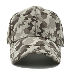 Detail of camouflage baseball cap showing six-panel stitching and curved brim textures