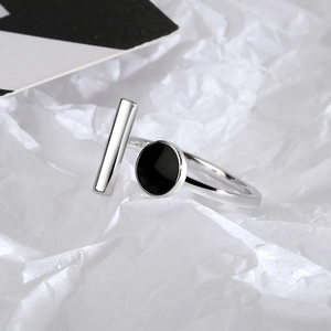 Minimalist silver geometric open ring with black enamel circle and 3D bar detail