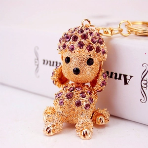 Sparkling purple rhinestone poodle keychain with gold metal base and lobster clasp for bags