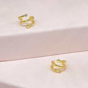 Minimalist 18k gold plated star ear cuff with zircon stones on pink geometric steps