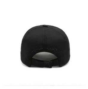 Detail of black quick-dry baseball cap featuring breathable laser-cut holes and back buckle