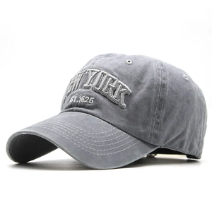 Close-up of deep gray washed cotton baseball cap with white NEW YORK 3D embroidery