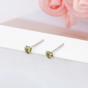 Close-up of 3mm olive green heart-shaped S925 sterling silver minimalist stud earrings