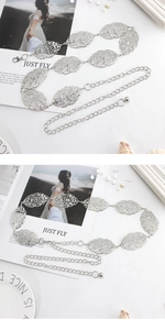 Detailed view of silver metal leaf belt with hollow design and adjustable chain link