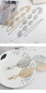 Detail of hollow leaf metal belts in gold and silver with lobster clasp and chain
