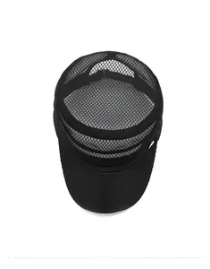 Top view detail of the black mesh flat top hat showing breathable hexagonal texture