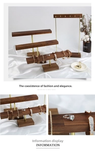 Macro detail of walnut wood jewelry stands with high-quality brass rod connections