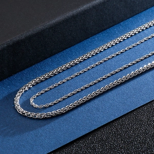 Three assorted silver stainless steel chains including wheat, rope and link styles for men