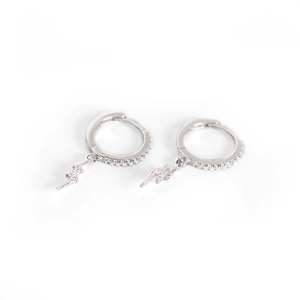 Elegant silver lightning bolt drop earrings with pave-set crystals on white background