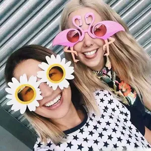 Funny party sunglasses set featuring pink flamingo and white daisy flower designs