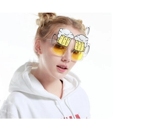 Funny daisy sunglasses with yellow lenses worn by a model on a white background